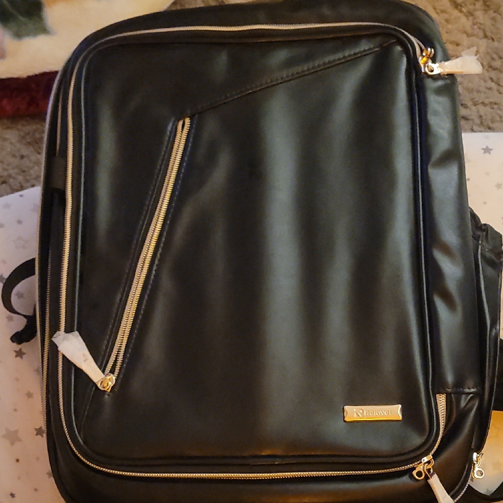 This is a professional black FA leather makeup artist backpack with gold